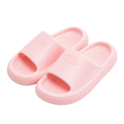 Barnbadtofflor med mjuk sula i rosa, bred rem och öppen ovansida.
