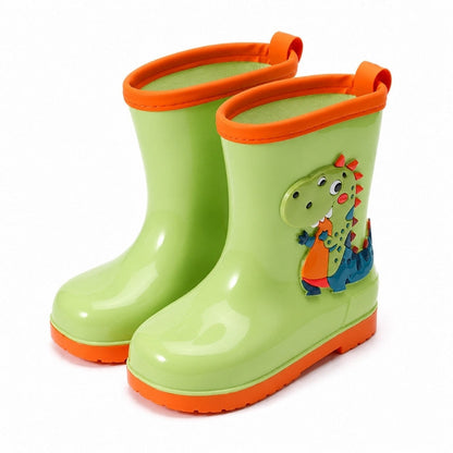 Barnens gummistövlar i ljusgrönt med dinosauriefigur och orange sulkant.