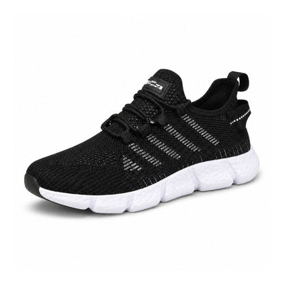 Svarta lätta sneakers i ventilerande mesh med vit sula och kardborreflik