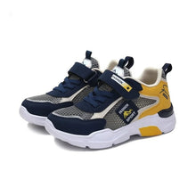 Marinblåa barnsneakers med gul accent, kardborreband, mesh och vit, tjock sula