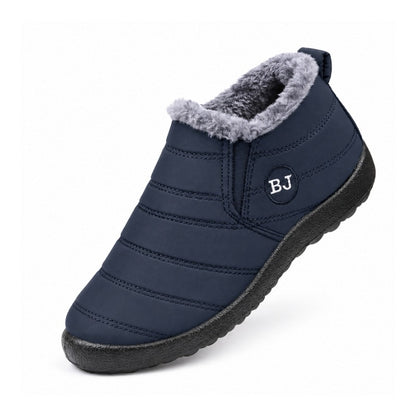 Varmfodrade slip-on skor i grön med grå foderpäls och mörk yttersula