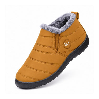 Varmfodrade slip-on skor i gul med grå pälskant och kraftig, mörk sula