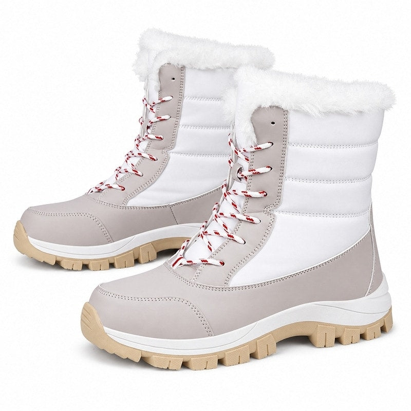 Damvinterkängor i vit/beige med mjukt foder, snörning med röda snören och kraftig sula.